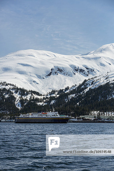An Alaska Marine Highway ferry arrives at the Whittier harbor in the winter  Prince William Sound  Southcentral Alaska  USA  Winter