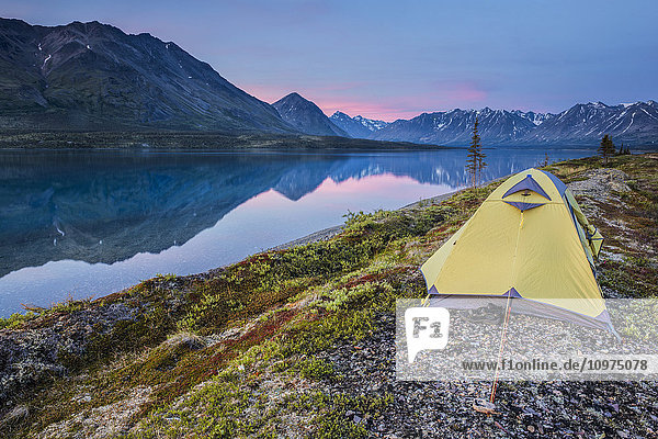 Scenic view of Lower Twin Lake with a backpacking tent in the foreground and sunset  Lake Clark National Park & Preserve  Southcentral Alaska