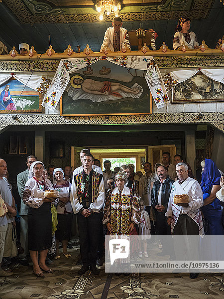 'Wedding ceremony in the Orthodox Church  Hutsuls are a small mountain peoples who inhabited Carpathians  in traditional folk costumes seen only during the holidays or weddings; Kryvorivnia  Verkhovyna district  Ivano-Frankivsk region  Ukraine'