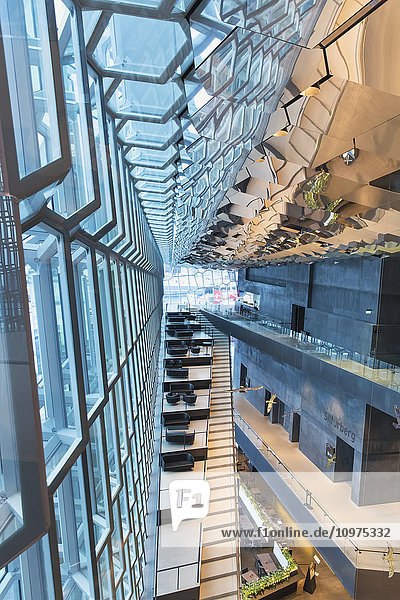 'Interior of the Harpa Public Concert Hall designed by the Danish firm Henning Larsen Architects and the Icelandic firm Batteriao Architects the glass facade designed by Icelandic glass artist Olafur Eliasson; Reykjavik Iceland'