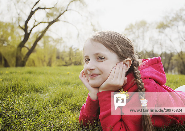 'Portrait of young girl at a park; Toronto  Ontario  Canada'