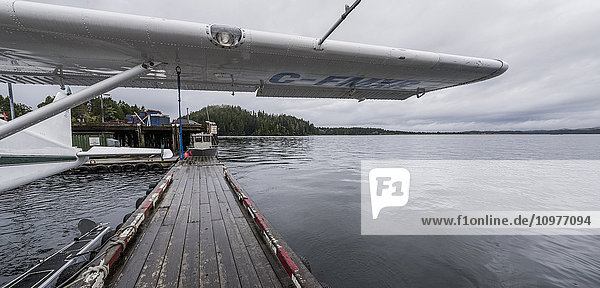 'Float plane by dock; Tofino  Vancouver Island  British Columbia  Canada'