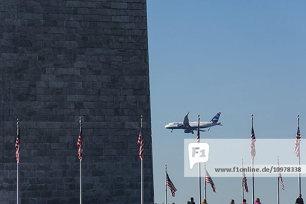 'A jetBlue Airbus A320E aircraft with winglets (sharklets) flies by the Washington Monument on way to land at Reagan National Airport; Washington  District of Columbia  United States of America'