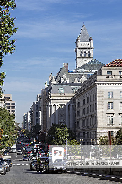 'View down Twelfth Street NW toward 315-foot clock tower of the Old Post Office Pavilion from corner of Constitution Avenue  pavilion being developed as a Donald Trump hotel  tower administered by National Park Service and built in 1899; Washington  District of Columbia  United States of America'