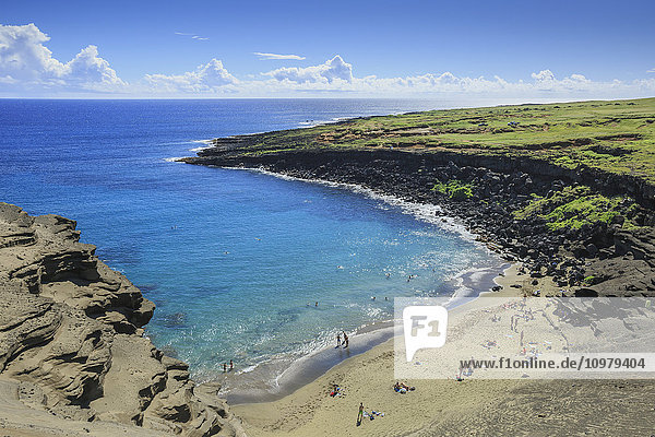 'Green Sand Beach  or Papakolea Beach  is a hike from South Point Hawaii and is know for the distinct color from olivine mineral; Naalehu  Island of Hawaii  Hawaii  United States of America'