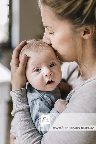 Mother with baby boy at home