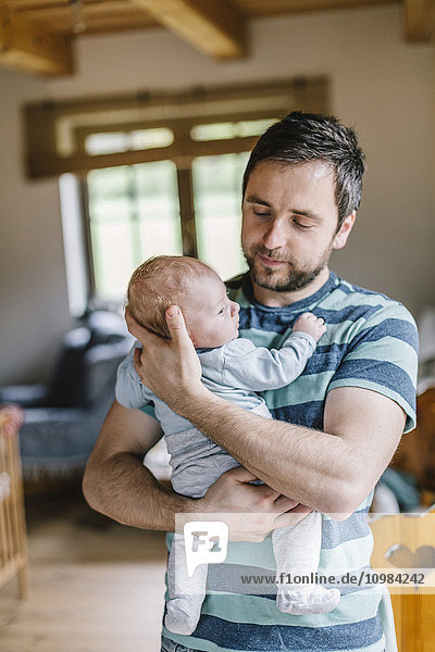 Father with baby boy at home