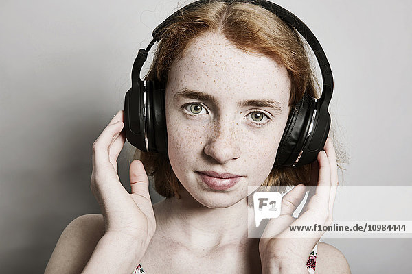 Girl listening music with headphones