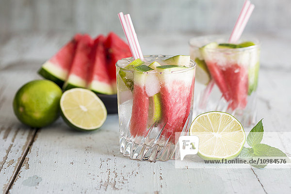 Fresh mineral water with watermelon  lime and ice in glasses