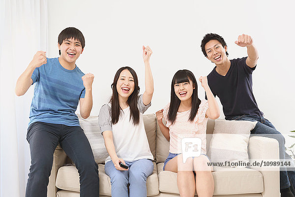Group of Japanese supporters in the living room