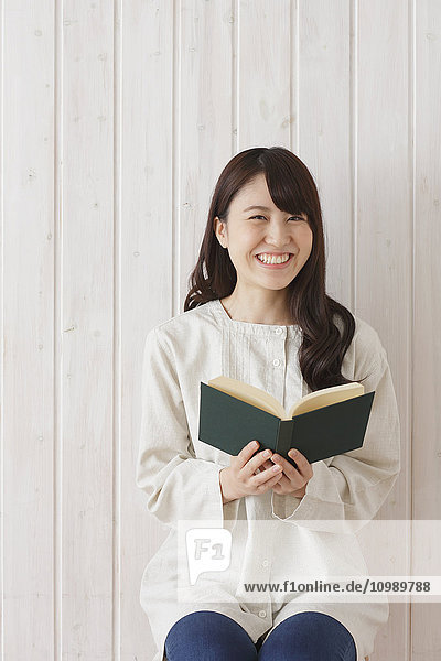Young Japanese woman with book
