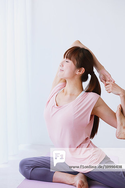Young Japanese woman practicing yoga