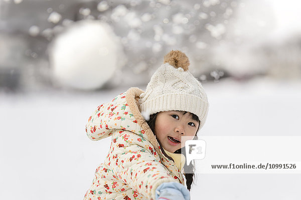 Kid playing in the snow