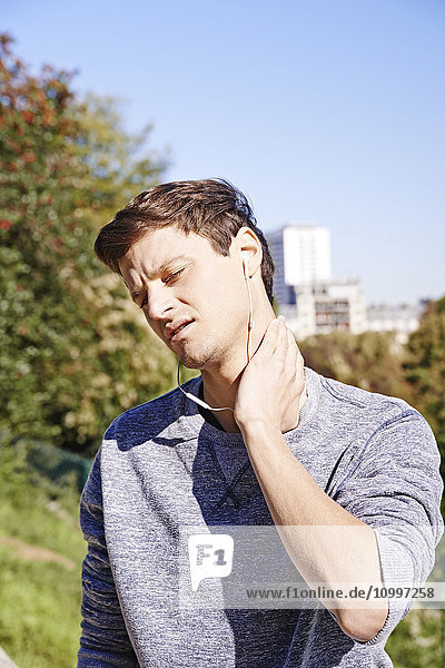 Man suffering from cervical pain.