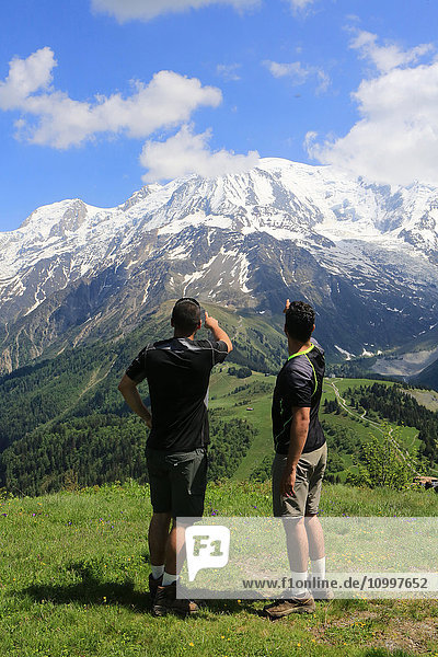 Two teenagers watching Mont Blanc massif.
