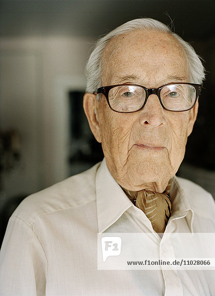 Portrait of an elderly man looking into the camera.