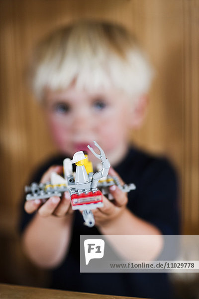 Boy playing Lego spaceship