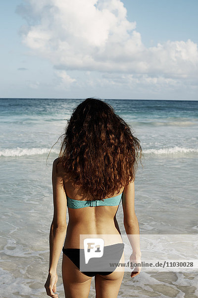 Young woman in bikini on beach