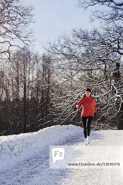 Mature woman jogging in winter