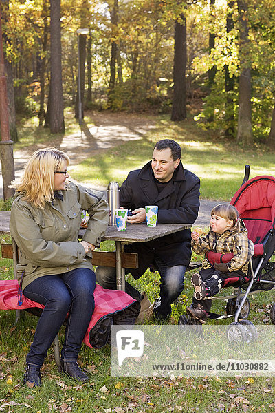Family having coffee break outdoor