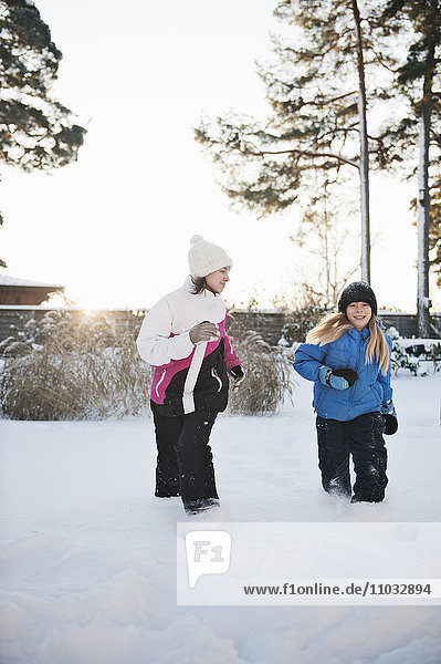 Girls running at winter  Saltsjobaden  Nacka  Sweden