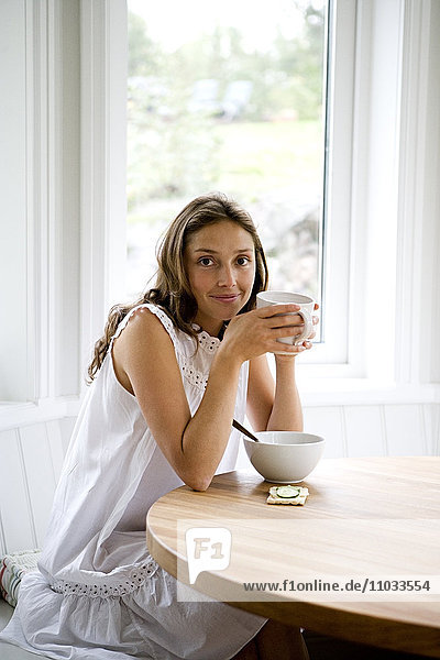 A woman having breakfast.