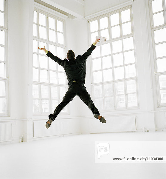 A man jumping in happiness.