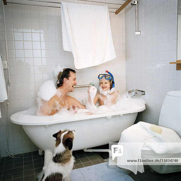 Scandinavian father and son taking a bath together  Hammarby sjostad  Sweden.