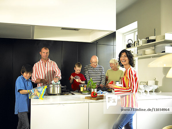 A family in a kitchen.