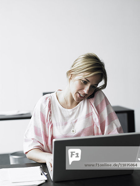 A woman working in an office.