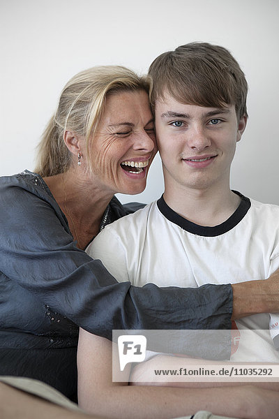 Smiling mother with teenage