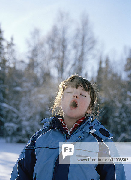 A girl breathing in the cold air Sweden.
