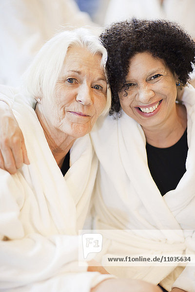 Portrait of mother and mature daughter relaxing in spa