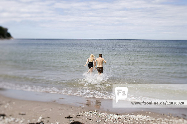 A couple on the beach  Gotland  Sweden.