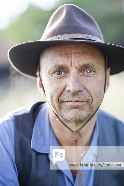 Portrait of mature man wearing hat