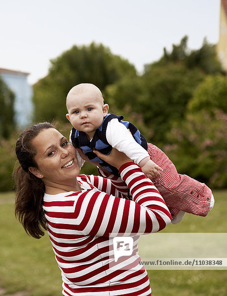 Portrait of a woman with holding her baby  Sweden.