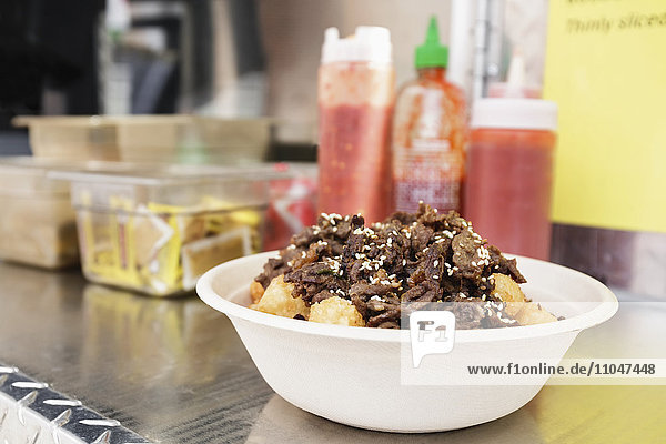 Bowl of food on shelf of food truck