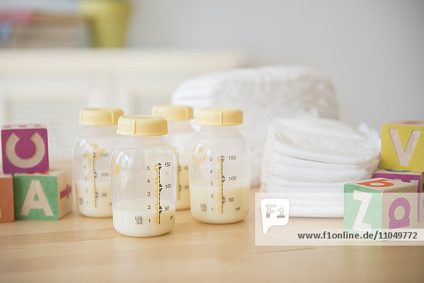 Blocks  diapers and bottles of breast milk