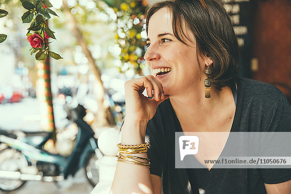Caucasian woman laughing outdoors