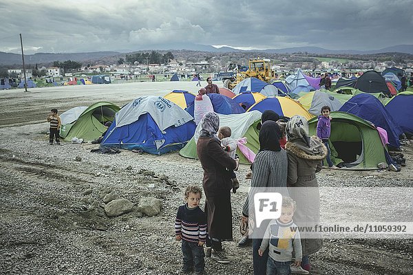 Idomeni refugee camp on the Greek Macedonia border  family arrives at the camp looking for a place where to put their tent  Idomeni  Central Macedonia  Greece  Europe