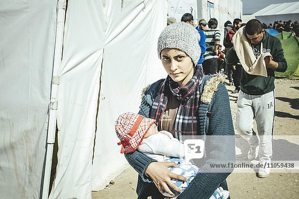 Idomeni refugee camp on the Greece Macedonia border  mother with her baby  Idomeni  Central Macedonia  Greece  Europe