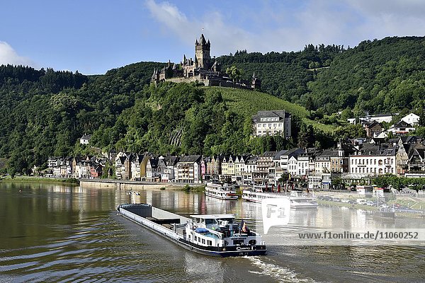Cargo ship on the Moselle  view of Cochem with the Reichsburg  Cochem on the Mosellele  Rhineland-Palatinate  Germany  Europe