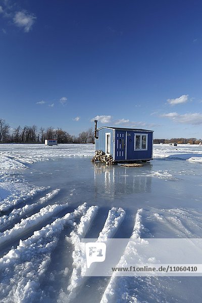 Ice fishing cabin on frozen Saint Lawrence River, Maple Grove