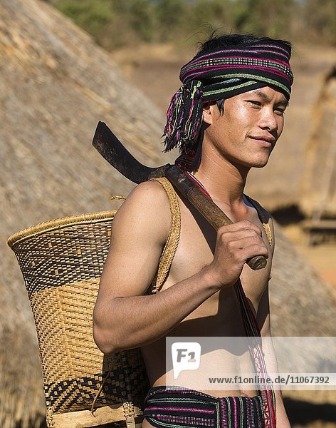 Man in traditional costume  ethnic minority  Pnong  Bunong  Senmonorom  Sen Monorom  Mondulkiri Province  Cambodia  Asia