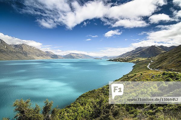 Blue sky with clouds over turquoise lake  Lake Wakatipu  right Glenorchy-Queenstown Road  New Zealand  South Island  Oceania