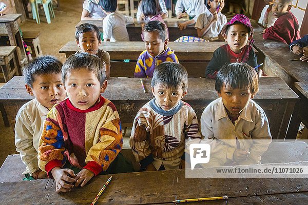 School children sitting at their desks  classroom  Shan State  Myanmar  Asia