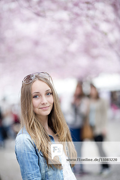 Smiling teenage girl looking at camera