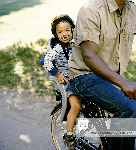 Boy on bike seat