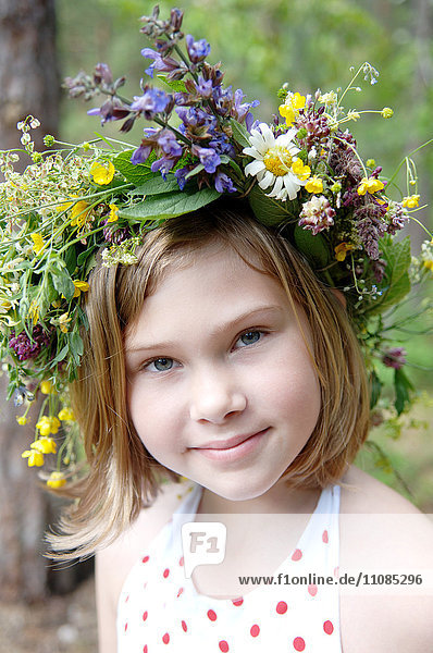 Portrait of a girl with a wreath of flowers in her hair  Sweden.