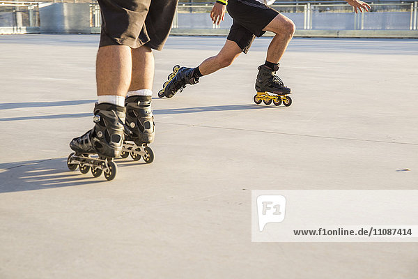 Men with rollerblades skating